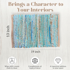 May include: A rectangular woven rug with a turquoise and brown pattern, measuring 19 inches by 13 inches. The rug has a natural fiber border and the text "Brings a Character to Your Interiors". It is designed to complement all types of decor.
