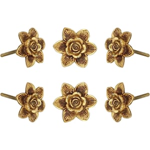 May include: Six golden flower-shaped cabinet knobs. Each knob features a detailed floral design with a central rose and surrounding petals. The knobs have a brass finish and are mounted on threaded rods for installation.