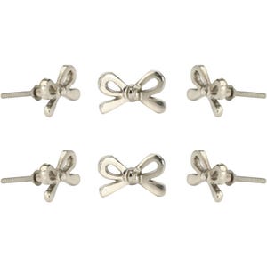 May include: Six silver-coloured bow-shaped cabinet knobs. Each knob has a bow design with a rounded centre and two loops. The knobs are attached to a threaded rod for installation. These decorative knobs are suitable for furniture.