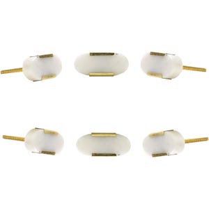 May include: Six white oval cabinet knobs with brass accents and gold-colored threaded posts. The knobs are arranged in a grid pattern against a white background. The knobs are made of a smooth, polished material.