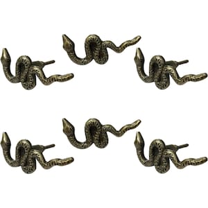 May include: Set of five bronze-colored snake-shaped cabinet knobs. Each knob features a detailed snake design with a textured surface and a small, protruding handle for easy grip. The knobs are ideal for adding a unique touch to furniture.