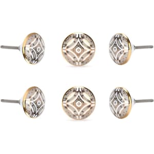 May include: Six decorative cabinet knobs with a geometric design. The knobs are round with a silver screw and a gold-coloured edge. The design features a pattern of grey, white, and gold shapes.
