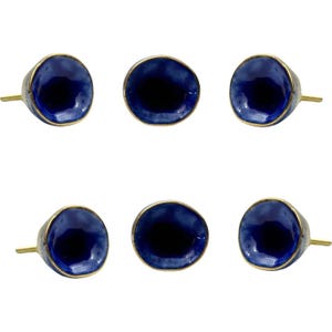May include: A set of six cabinet knobs with a deep blue, bowl-shaped face and a metallic gold-toned rim. Each knob features a smooth, glossy finish and a central indentation, attached to a thin, straight gold-colored metal mounting post.