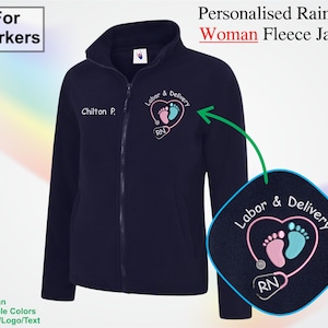 May include: Navy blue fleece jacket with a full zip and a high collar. The jacket has the text "Chilton P." and a "Labor & Delivery" design with pink and blue footprints. The text "For Workers" is in the upper left.
