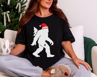 Christmas Monster Shirt, Funny Sasquatch Santa Hat Tee, Woodland Monster Holiday T-Shirt, Festive Winter Xmas Top, Christmas Gift For Her