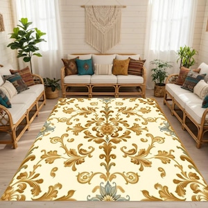 May include: A cream-colored area rug with a large, ornate gold and brown floral pattern dominates the room. The rug is surrounded by rattan sofas with white cushions and decorative pillows. Plants and woven baskets add to the room's decor.