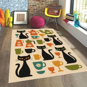 May include: A rectangular area rug with a cream background featuring a repeating pattern of black cat silhouettes, teapots, cups, and glasses in various colors. The rug has a retro, mid-century modern design.