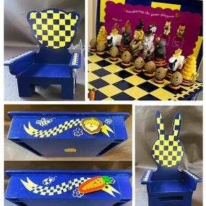 May include: A blue wooden chair with a yellow and blue checkered backrest, alongside a board game featuring a yellow and blue checkered surface and various small character figurines. The game box displays the text Introducing the game players.