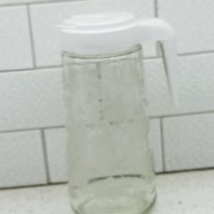 Lovely Anchor Hocking 1 Quart Tang Etched Glass Juice Pitcher. Vintage Tang/Juice Pitcher - Juice Pitcher with White Lilies