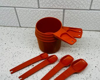 Vintage Tupperware Harvest Orange Measuring Cups Set of 3 and Measuring Spoons set of 4.