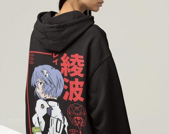 May include: Black hoodie featuring a Japanese anime character illustration in red and white. The design includes Japanese text and a stylized image of a character with blue hair. The hoodie has a drawstring hood and a relaxed fit.