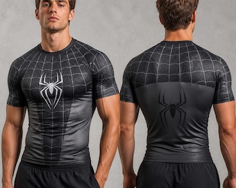 May include: A black short-sleeved compression shirt featuring a white spider emblem on the chest and a black spider emblem on the back. The upper chest and shoulders display a white spiderweb pattern, while the lower torso is solid black.
