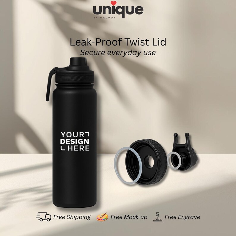 May include: A matte black cylindrical water bottle with a twist lid and a carry handle. The bottle features the text "YOUR DESIGN HERE" in white. The lid is shown disassembled with a clear silicone sealing ring and a separate spout component.