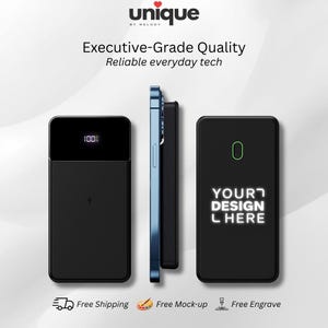 May include: A black rectangular power bank with a digital display showing 100% charge, a side view of a blue smartphone attached to a power bank, and a black power bank with a green outline and the white text YOUR DESIGN HERE.