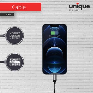 May include: A black circular magnetic charging cable connector with the text YOUR DESIGN HERE, shown in both non-illuminated and illuminated states, connected to a smartphone displaying a 66% battery charge icon and the text Battery remaining: 66%.
