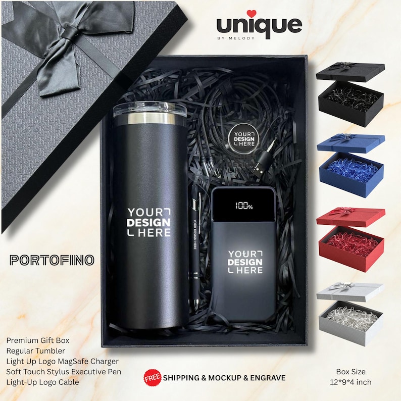 May include: A black gift box containing a dark gray tumbler, a digital power bank displaying 100%, a black stylus pen, and a charging cable. The box lid features a black ribbon. The text "YOUR DESIGN HERE" is printed on the tumbler and power bank.