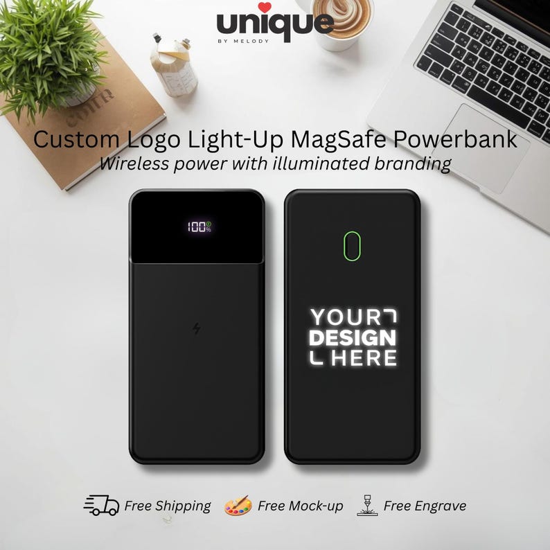May include: Two black rectangular MagSafe power banks. The left unit displays a digital 100% battery indicator and a lightning bolt icon. The right unit features an illuminated outline and the text YOUR DESIGN HERE in a glowing white font.