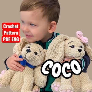 May include: Two plush crochet animal toys, one a bear with a blue bow, the other a bunny with a pink bow. The toys are beige with pink accents. The word "COCO" is written across the toys. Text in a red box reads "Crochet Pattern PDF ENG".