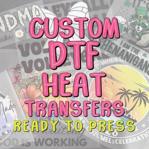 May include: A collection of DTF heat transfers, ready to press. The image features text in pink and yellow, including "CUSTOM DTF HEAT TRANSFERS READY TO PRESS." Various designs are visible, including floral, beach, and text-based graphics.