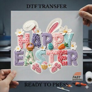 May include: A DTF transfer sheet with the words "HAPPY EASTER" in colorful, textured letters. The design includes bunny ears, flowers, an Easter egg, a carrot, a basket, and paw prints. The text "READY TO PRESS" is also visible.