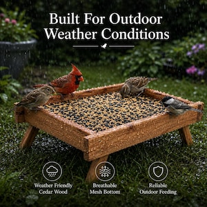 May include: A rectangular wooden bird feeder with a mesh bottom filled with black and yellow seeds. The text reads Built For Outdoor Weather Conditions, Weather Friendly Cedar Wood, Breathable Mesh Bottom, and Reliable Outdoor Feeding.