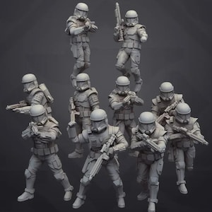 May include: A group of eleven gray action figures of soldiers in futuristic armor, helmets, and weapons. The figures are in various action poses, some standing, some aiming their weapons. The figures are on a dark gray background.