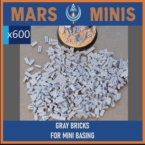 May include: A pile of approximately 600 gray miniature bricks for mini basing. The image includes the text "MARS MINIS" and "GRAY BRICKS FOR MINI BASING". The bricks are a light gray color and appear to be made of plastic.