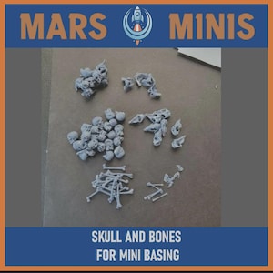 May include: A collection of grey plastic skulls and bones for miniature basing. The image shows several small skulls, rib cages, and individual bones. The text "MARS MINIS" and "SKULL AND BONES FOR MINI BASING" are displayed.