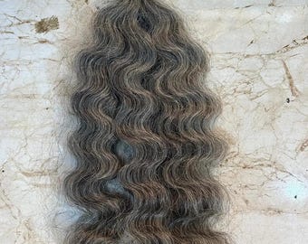 Curly tape in human hair extensions