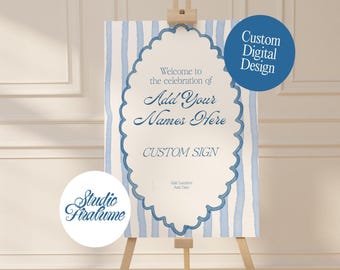 May include: A custom sign on an easel with a blue and white striped background. The sign has a scalloped border and text that reads "Welcome to the celebration of Add Your Names Here CUSTOM SIGN". A blue circle says "Custom Digital Design".