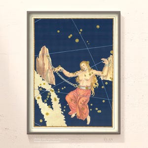 May include: Framed vintage print of a celestial map featuring a nude woman with long blonde hair, chained to rock formations. The woman is wearing a red skirt, set against a dark blue background with constellations and gold accents. The artwork is framed in a grey border.