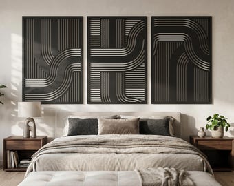 May include: A set of three rectangular wall art panels featuring a black surface with cut-out geometric patterns of parallel lines and curved paths. The design consists of vertical and horizontal linear elements that create a layered effect.