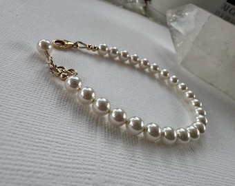 Bracciale di perle Swarovski: cristallo bianco, chiusura riempita d'oro