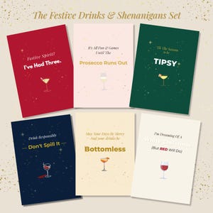 May include: A set of six festive greeting cards with cocktail illustrations. The cards feature phrases like "Festive Spirit? I've Had Three" and "I'm Dreaming Of A White Christmas (But RED Will Do)". Each card has a different color background.