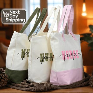 three tote bags with personalized names printed on them, placed on a wooden surface.