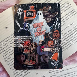 May include: A square sticker featuring a collage of horror movie characters and Halloween imagery, including a ghost, pumpkins, and text such as Trick or Treat, Fright Night, I Put A Spell On You, Horror, and Spooky Babe, set against a dark background.