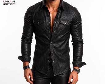 May include: A black leather shirt featuring a pointed collar, long sleeves with buttoned cuffs, and two chest pockets with button-down flaps. The shirt has a front button closure with metallic buttons and is paired with matching black leather trousers.