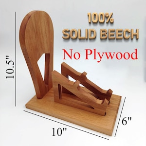 K&ouml;nnte beinhalten: Ein Telefonst&auml;nder aus massivem Buchenholz. Der St&auml;nder ist 25,4 cm lang, 15,2 cm breit und 26,7 cm hoch. Der Text "100% SOLID BEECH No Plywood" ist sichtbar.