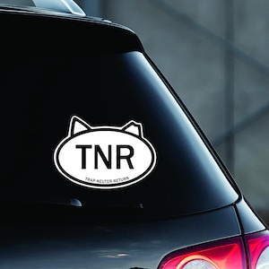 May include: A white vinyl sticker with a black outline of a cat's head and the text "TNR" inside an oval. Below the oval is the text "TRAP-NEUTER-RETURN".