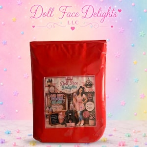 May include: A rectangular red pouch containing air dry foam clay. The front label features the text Doll Face Delights LLC, Air Dry Foam Clay, and an illustration of a person standing next to a black dog in front of a shop storefront.