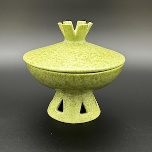 May include: A rustic wooden sign with the text "Welcome to our home" in white lettering. The sign features a distressed finish and a simple, inviting design, perfect for entryway decor.