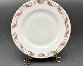 Plato antiguo de pan y mantequilla Royal Bayreuth, c. 1902 / Guirnalda floral de rosas rosas y moradas, borde dorado / 15,9 cm (6,25"), porcelana.