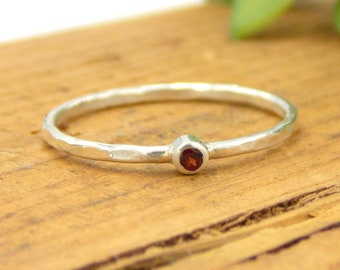 Tiny Hammered Garnet Stacking Ring made from sterling silver, a small and dainty January birthstone ring