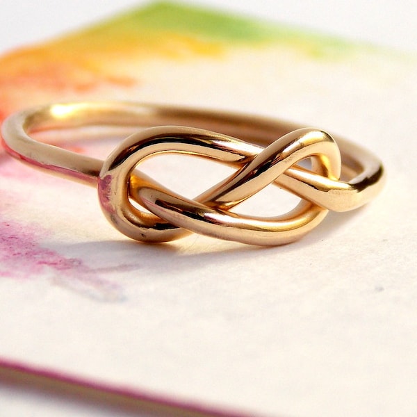 Gold Infinity Knot Ring made from 14K Gold-filled: A golden ring perfect for a love knot promise ring.