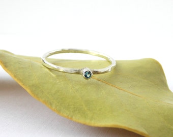 Tiny Hammered Blue Zircon Stacking Ring made from sterling silver, a dainty birthstone ring for December