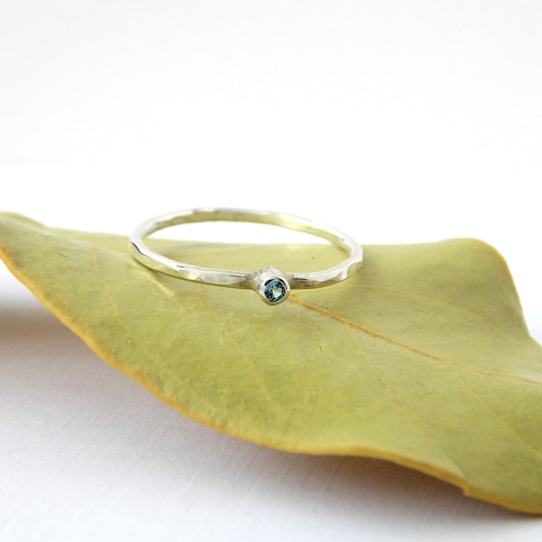 Tiny Hammered Blue Zircon Stacking Ring made from sterling silver, a dainty birthstone ring for December