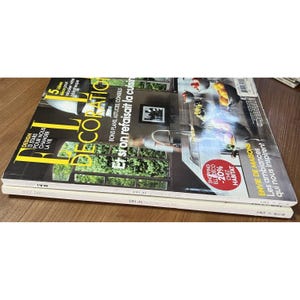 Puede incluir: Una portada de revista que muestra una cocina con una encimera blanca y un fregadero. La revista se titula "Decoraci&oacute;n" y el texto de la portada dice "Et si on refaisait la cuisine", que se traduce como "&iquest;Y si remodel&aacute;ramos la cocina?".