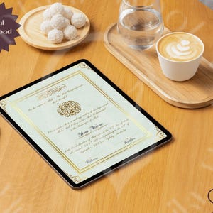 May include: A digital download certificate on a tablet, featuring gold calligraphy and a decorative border. A white stylus rests beside the tablet. The scene includes a cup of coffee, a glass of water, and a plate of white treats on a wooden table.