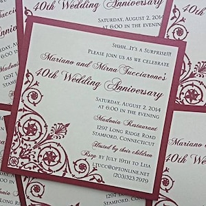 May include: A burgundy and white wedding invitation with ornate floral designs. The invitation reads "Mariano and Mirna Tucciarone's 40th Wedding Anniversary" and includes the date, time, and location of the event. The text "SHHH...IT'S A SURPRISE!!!" is printed in all caps at the top of the invitation.