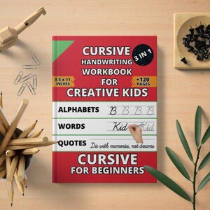 May include: A red and white cursive handwriting workbook for creative kids, 8.5 x 11 inches, with the text "Cursive Handwriting Workbook for Creative Kids". The image also includes pencils, paper clips, and a wooden artist's mannequin.